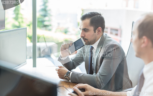 Image of Business team analyzing data at business meeting.