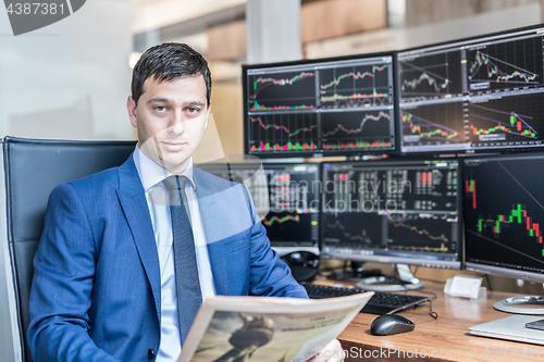 Image of Business portrait of stock broker in traiding office.