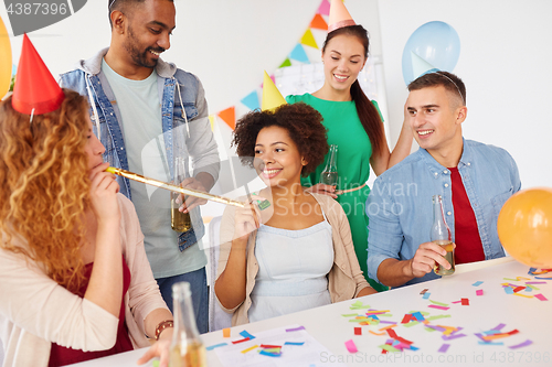 Image of happy team having fun at office party