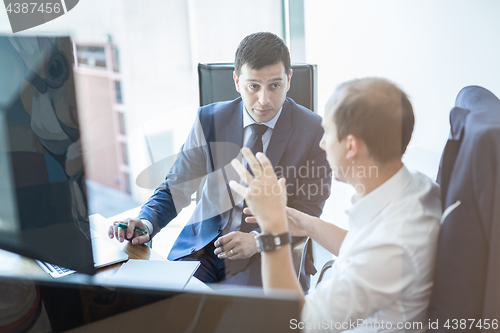 Image of Business team brainstorming and dicussing business ideas at business meeting.