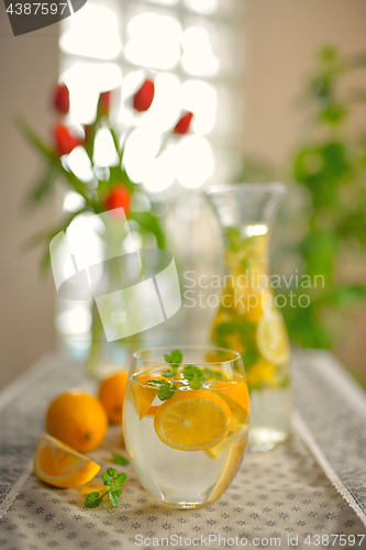 Image of Fresh limes and lemonade on table