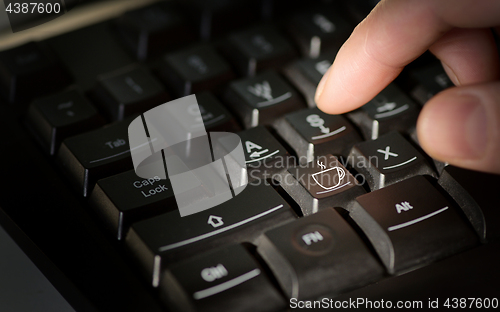 Image of Coffee sign on computer keyboard