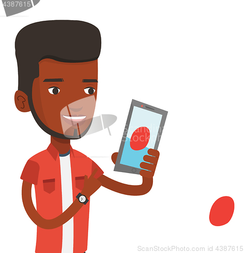 Image of Man playing action game on smartphone.