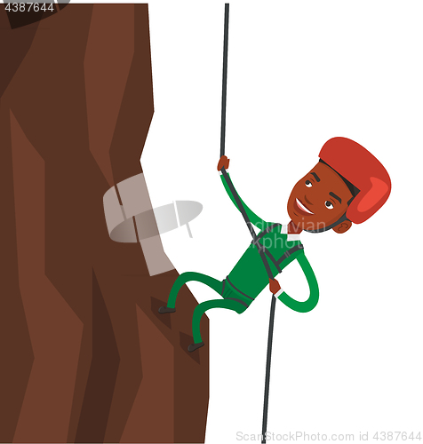 Image of Man climbing in mountains with rope.