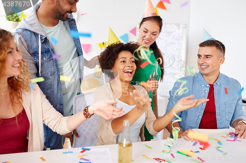 Image of happy team having fun at office party