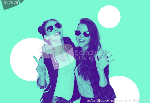 Image of smiling teenage girls in sunglasses having fun