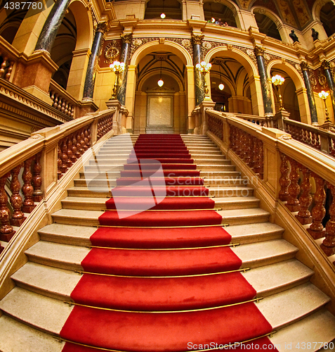 Image of stairs with red carpet