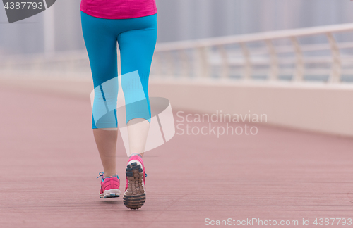 Image of woman running on the promenade