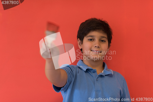 Image of Portrait of a happy young boy painter