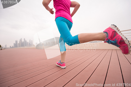 Image of woman running on the promenade