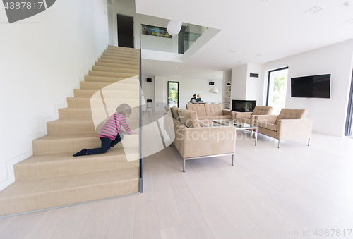 Image of family with little girl enjoys in the modern living room