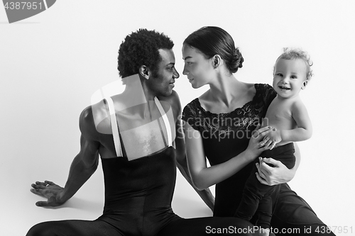 Image of A happy family of ballet dancers on white studio background