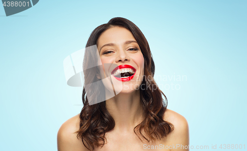 Image of beautiful laughing young woman with red lipstick