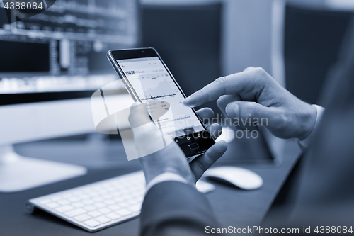 Image of Close up of businessman using mobile smart phone.