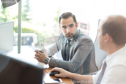 Image of Business team brainstorming and dicussing business ideas at business meeting.