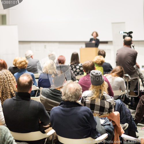 Image of Woman giving presentation on business conference.