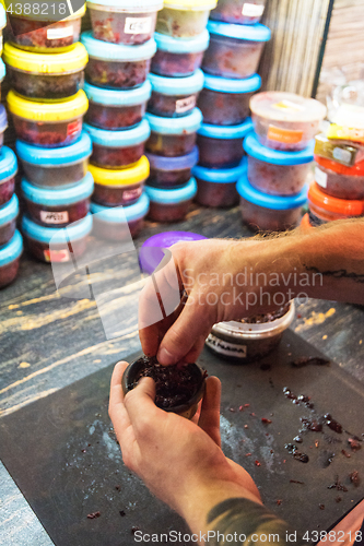 Image of Shisha hookah preparing by barman.