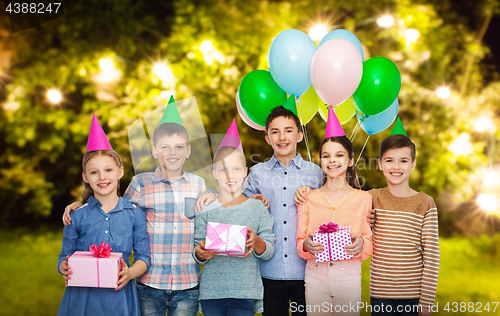 Image of happy children with gifts at birthday party