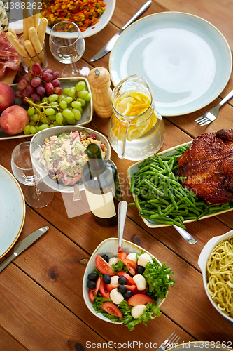 Image of various food on served wooden table