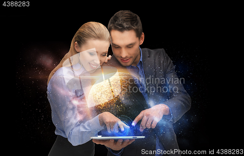 Image of businesspeople with tablet pc and planets in space