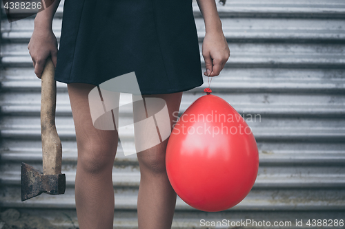 Image of Teenage girl standing near a wall