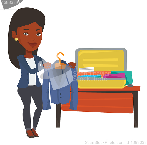 Image of Woman packing her suitcase vector illustration.