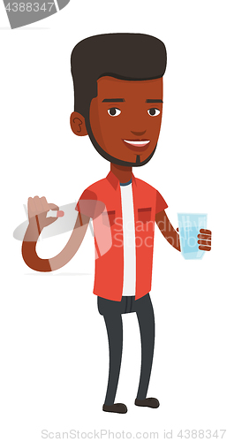 Image of Young african-american man taking pills.