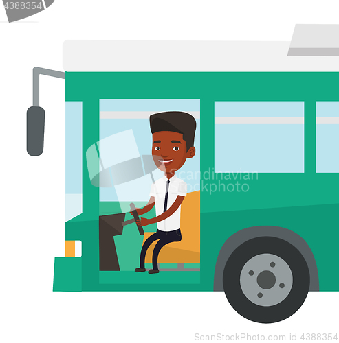 Image of African bus driver sitting at steering wheel.