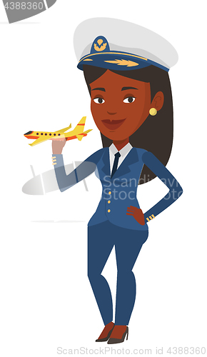 Image of Cheerful airline pilot with model of airplane.