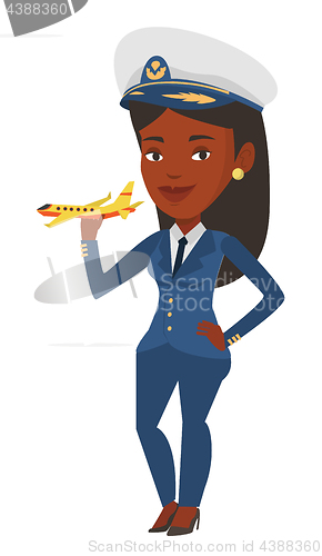 Image of Cheerful airline pilot with model of airplane.