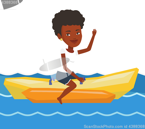 Image of Tourists riding a banana boat vector illustration.