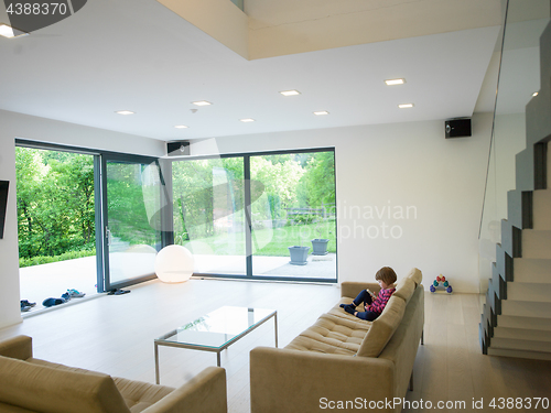 Image of little girl playing games on smartphone