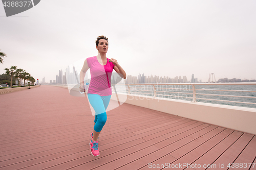 Image of woman running on the promenade