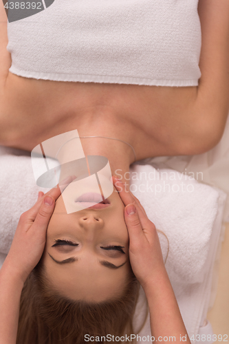 Image of woman receiving a head massage