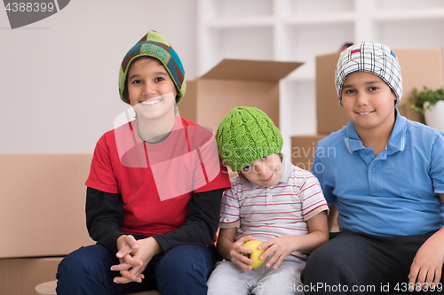Image of boys with cardboard boxes around them