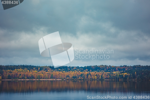 Image of Autumn trees with reflection