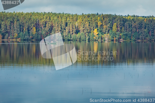 Image of Autumn trees with reflection