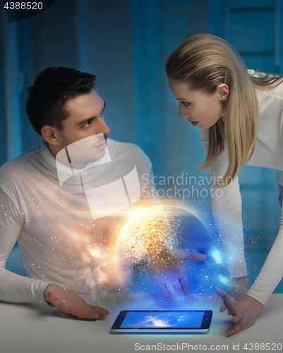 Image of couple with tablet pc at space laboratory