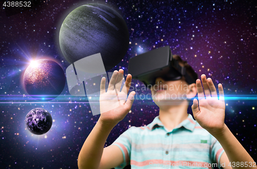 Image of boy with virtual reality headset outdoors