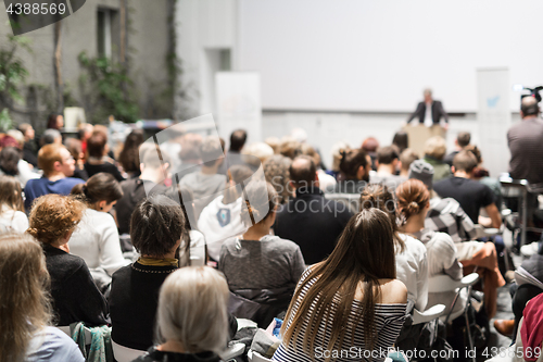 Image of Business speaker giving a talk at business conference event.