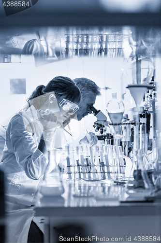 Image of Health care researchers working in scientific laboratory.