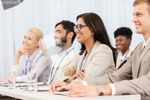 Image of happy business team at international conference