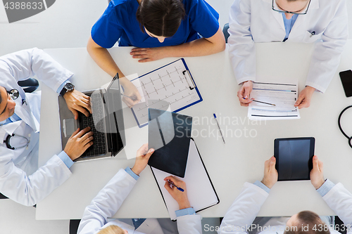 Image of doctors with x-ray and cardiogram at hospital