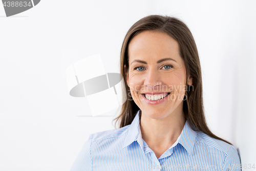 Image of face of happy smiling middle aged woman