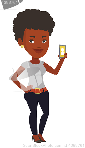 Image of Woman holding ringing mobile phone.
