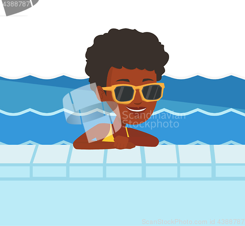 Image of Smiling young woman in swimming pool.