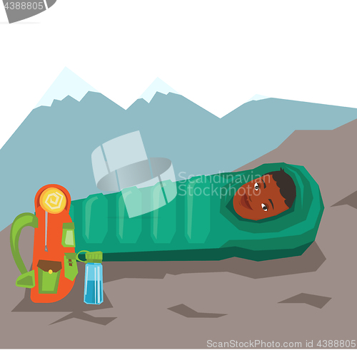 Image of Woman resting in sleeping bag in the mountains.