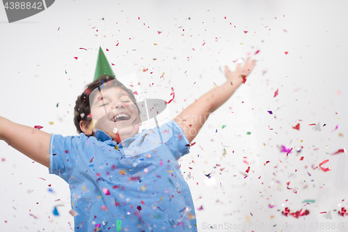 Image of kid blowing confetti