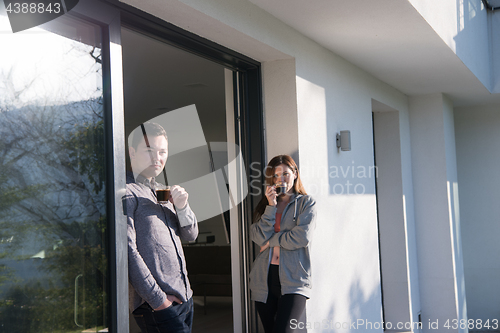 Image of couple enjoying on the door of their luxury home villa