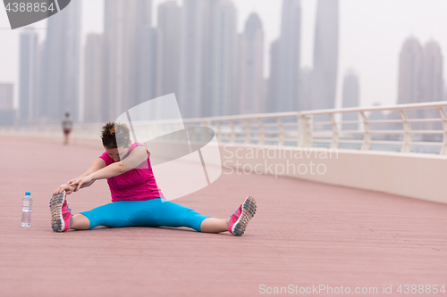 Image of woman stretching and warming up